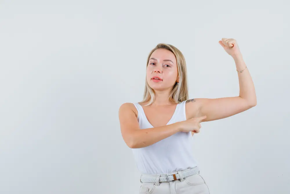 a woman showing her left arm before an arm lift surgery in turkey