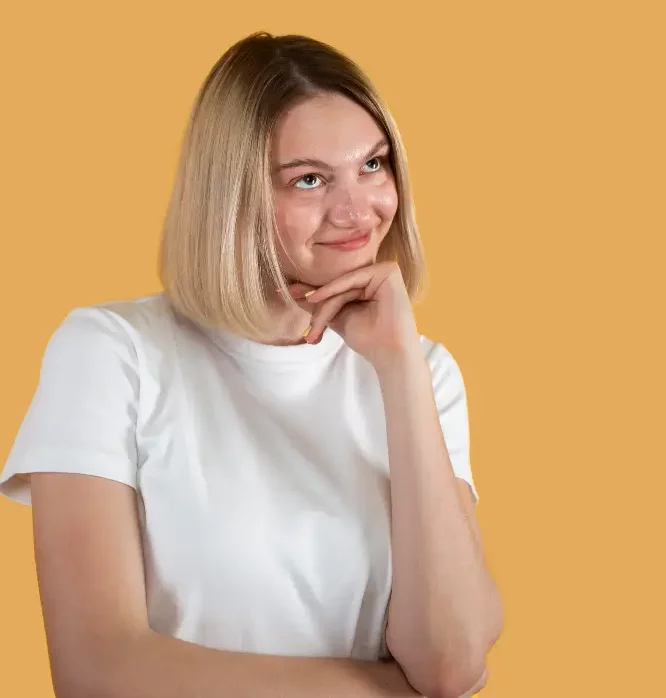 a woman showing her buccal fats while holding her cheek