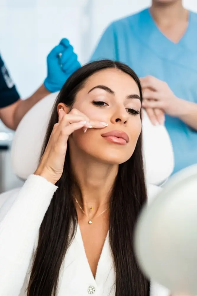 a woman showing off her lips after a lip lift surgery